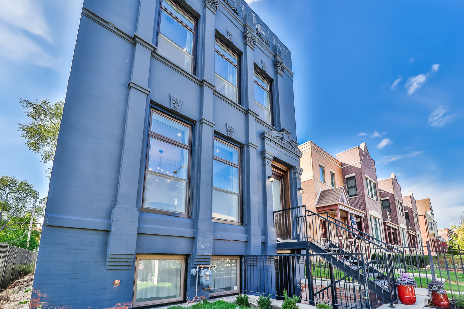 Renovated South Side Chicago multifamily building, masonry exterior with a raised entry.